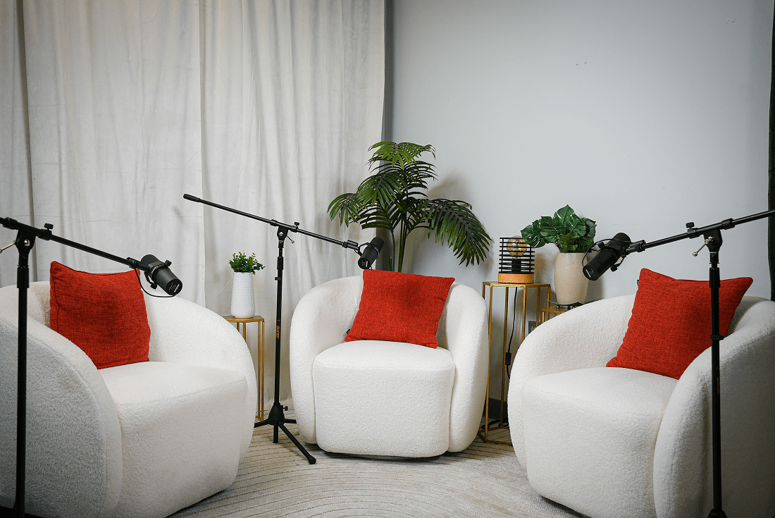 The Set Philly's white armchair podcast studio set near Philadelphia's Center City.